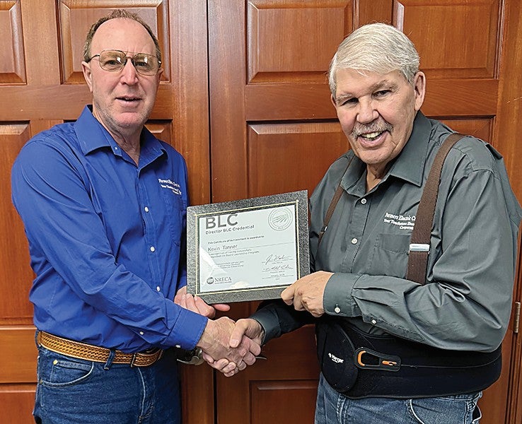 Board member Kevin Tanner receives certificate